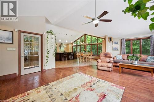 Open-concept living space featuring wood-finish flooring, a vaulted ceiling - 410 Avenue Road, Cambridge, ON - Indoor Photo Showing Living Room
