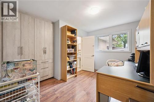 Custom built-in storage cabinetry with light wood-finish doors and drawers - 410 Avenue Road, Cambridge, ON - Indoor