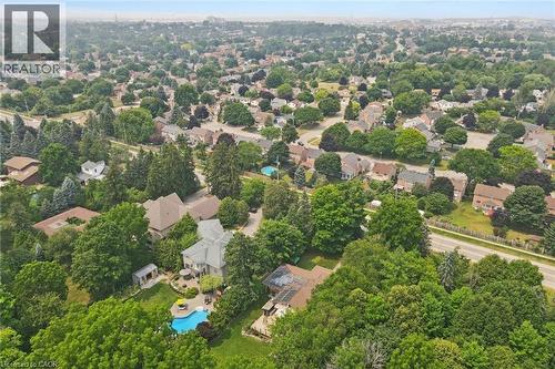 Aerial perspective showcasing a residential area with extensive tree canopy - 410 Avenue Road, Cambridge, ON - Outdoor With View