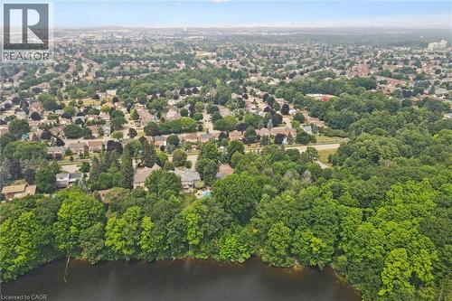 Expansive aerial view showcasing a residential area with extensive tree coverage and a prominent body of water in the foreground - 410 Avenue Road, Cambridge, ON - Outdoor With View