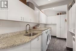 Dreamy Laundry Room with Lots of Storage - 