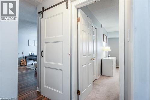 Modern barn door with black hardware - 67 Pinemeadow Crescent, Waterloo, ON - Indoor Photo Showing Other Room