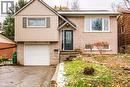 Split-level residence featuring a brick facade and vertical siding - 67 Pinemeadow Crescent, Waterloo, ON  - Outdoor With Exterior 