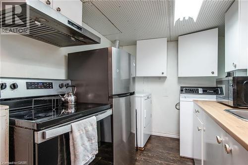 Compact kitchen and laundry area featuring stainless steel appliances - 67 Pinemeadow Crescent, Waterloo, ON - Indoor Photo Showing Kitchen