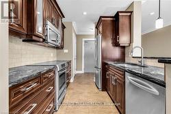Kitchen with ceramic tile and Stainless appliances - 