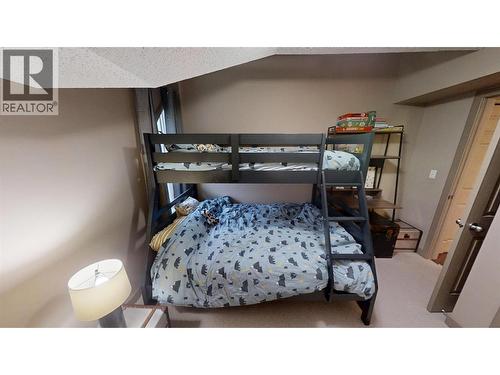 205 Third Avenue Unit# 1403, Invermere, BC - Indoor Photo Showing Bedroom
