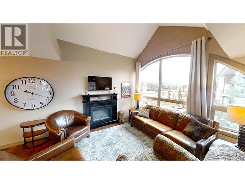 205 Third Avenue Unit# 1403, Invermere, BC - Indoor Photo Showing Living Room With Fireplace