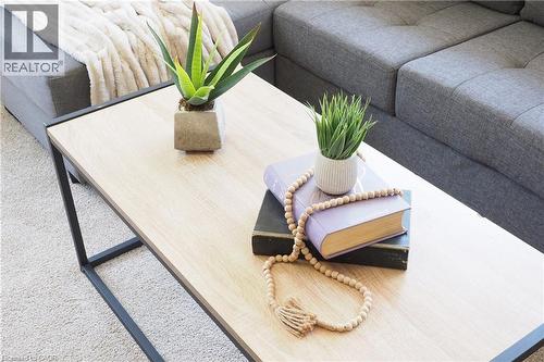 Light wood-finish coffee table with black metal frame and textured carpet - 148 Tiffany Street, Cambridge, ON -  Photo Showing Bedroom