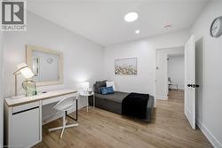 Light wood-finish flooring complements the neutral wall tones - 