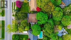 Aerial perspective highlighting a residential property with established landscaping - 