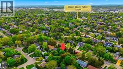 Aerial depiction of a residential neighborhood with mature tree coverage - 