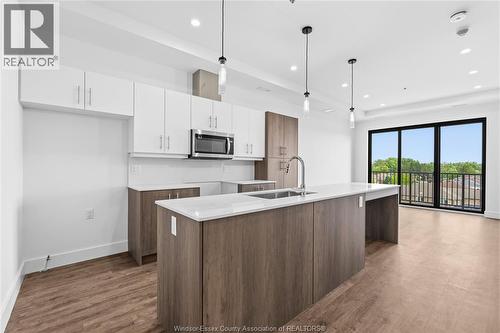 595 Lilymac Unit# 409, Windsor, ON - Indoor Photo Showing Kitchen With Upgraded Kitchen