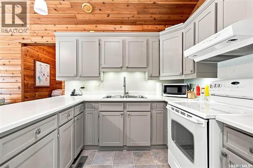 23 Saskatchewan Drive, Candle Lake, SK - Indoor Photo Showing Kitchen With Double Sink