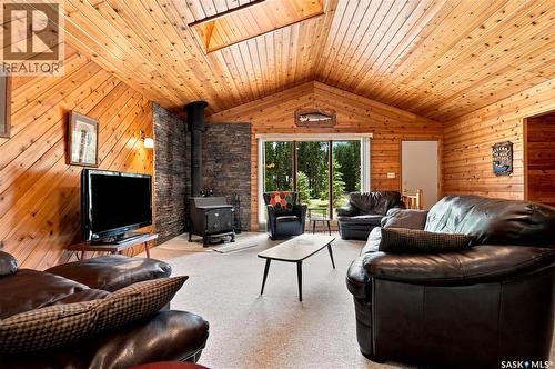 23 Saskatchewan Drive, Candle Lake, SK - Indoor Photo Showing Living Room With Fireplace