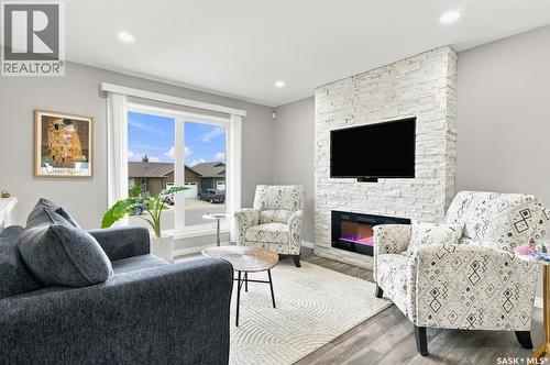 857 Reimer Road, Martensville, SK - Indoor Photo Showing Living Room With Fireplace