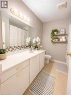 Modern bathroom featuring a sleek vanity wit ample storage, updated , and plenty of storage  for everyday convenience. - 