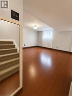 Spacious finished recreation room offering flexible living space for relaxing, entertaining, or family gatherings - 