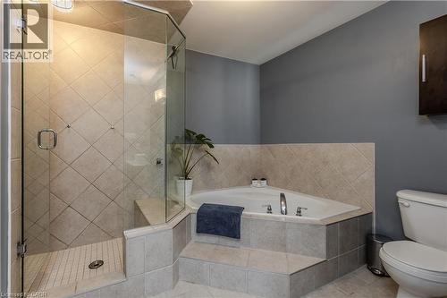Enclosed shower with clear glass surround and diagonal-set tile - 2121 Prospect Street, Burlington, ON - Indoor Photo Showing Bathroom