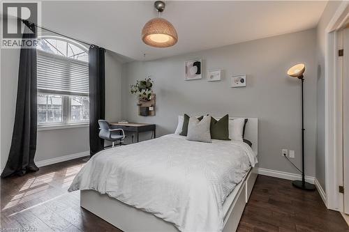 Bedroom with dark wood-finish flooring and light gray walls - 2121 Prospect Street, Burlington, ON - Indoor Photo Showing Bedroom