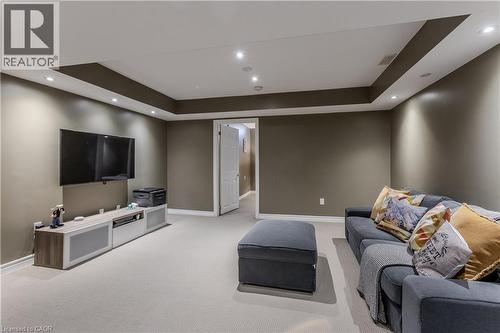 Spacious room featuring neutral wall tones, recessed lighting, and a tray ceiling detail - 2121 Prospect Street, Burlington, ON - Indoor