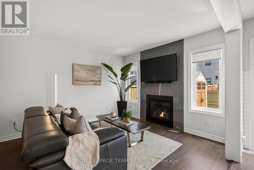 90 Buffalograss Crescent, Ottawa, ON - Indoor Photo Showing Living Room With Fireplace