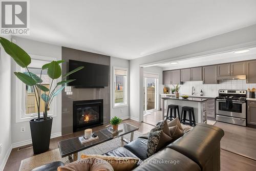 90 Buffalograss Crescent, Ottawa, ON - Indoor Photo Showing Living Room With Fireplace