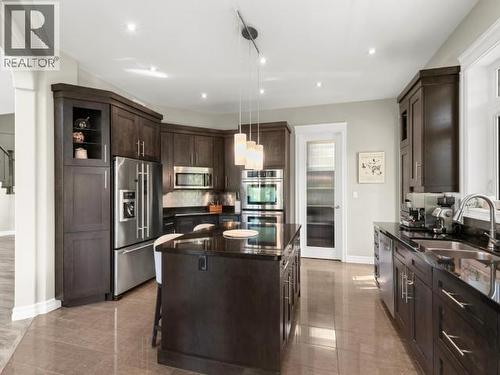 112 Alusru Way, Whitehorse, YT - Indoor Photo Showing Kitchen With Double Sink With Upgraded Kitchen