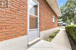 Side entrance with stamped concrete walkway - 