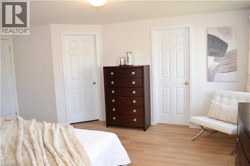 Light-toned wood-finish flooring complements the neutral wall color - 28 Lemon Grass Street, Kitchener, ON - Indoor Photo Showing Bedroom