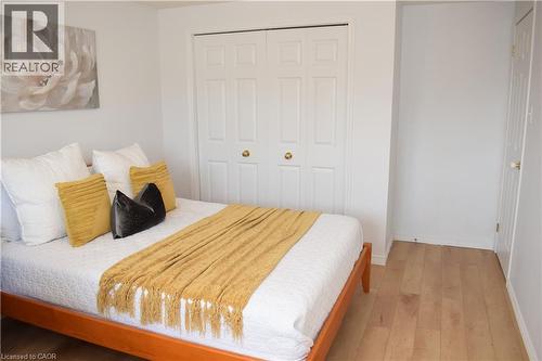 Light wood-finish flooring throughout the room - 28 Lemon Grass Street, Kitchener, ON - Indoor Photo Showing Bedroom