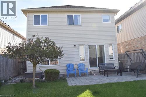 Rear exterior featuring light-colored siding and a dark shingle roof - 28 Lemon Grass Street, Kitchener, ON - Outdoor With Deck Patio Veranda With Exterior