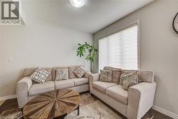 Interior room featuring light-colored walls and dark wood-finish flooring - 
