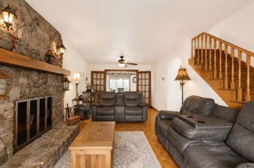 Living Room - 7243 Rue Des Martinets, Laval (Duvernay), QC - Indoor Photo Showing Living Room With Fireplace