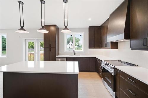 173 Harvest Cr, Lorette, MB - Indoor Photo Showing Kitchen With Upgraded Kitchen