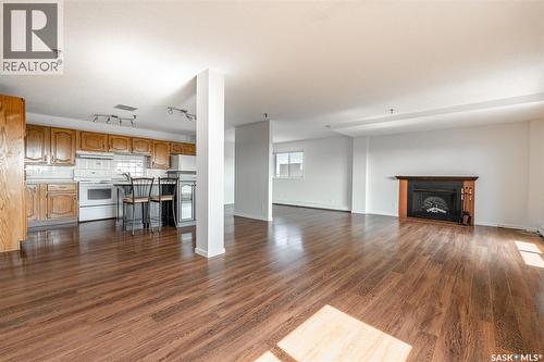 902 510 5Th Avenue, Saskatoon, SK - Indoor Photo Showing Living Room With Fireplace