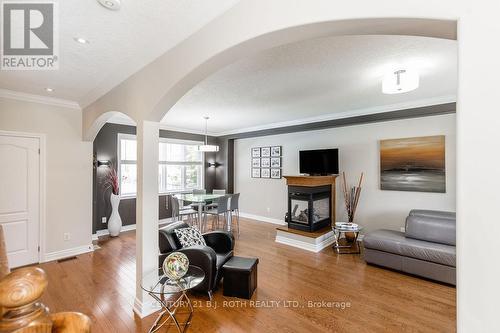 12 Lloyd Cook Drive E, Springwater, ON - Indoor Photo Showing Living Room With Fireplace