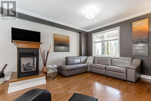 12 Lloyd Cook Drive E, Springwater, ON - Indoor Photo Showing Living Room With Fireplace