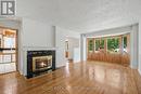 Wood burning fireplace - 1838 Louisiana Avenue, Ottawa, ON  - Indoor Photo Showing Living Room With Fireplace 