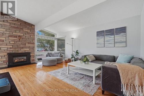 1272 Collins Avenue, Ottawa, ON - Indoor Photo Showing Living Room With Fireplace