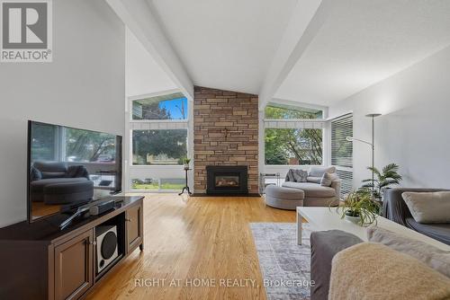 1272 Collins Avenue, Ottawa, ON - Indoor Photo Showing Living Room With Fireplace