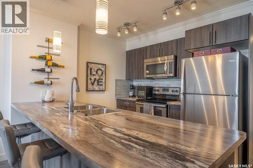 404 5301 Universal Crescent, Regina, SK - Indoor Photo Showing Kitchen With Stainless Steel Kitchen With Double Sink