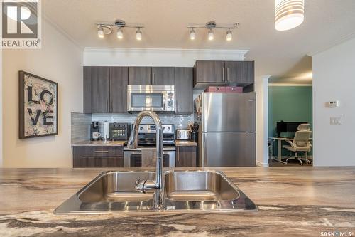 404 5301 Universal Crescent, Regina, SK - Indoor Photo Showing Kitchen With Stainless Steel Kitchen With Double Sink