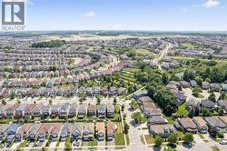 Extensive residential neighborhood featuring diverse housing styles, paved roadways, and green spaces - 