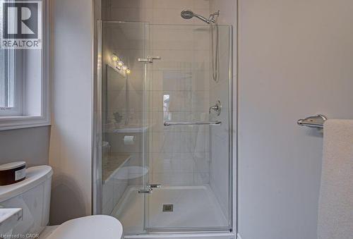 Glass-enclosed shower with a handheld showerhead and tiled interior - 15 Matheson Crescent, Innerkip, ON - Indoor Photo Showing Bathroom