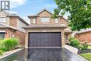 Two-story brick and stone exterior with an integrated two-car garage - 43 Liam Drive, Ancaster, ON  - Outdoor 