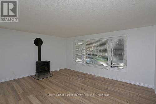 23 Pebble Beach Parkway E, South Huron, ON - Indoor With Fireplace