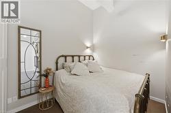 Comfortable Bedroom with High Ceilings and Built-in Cabinet - 