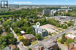 Aerial perspective showcasing the residential building and surrounding urban landscape - 