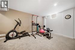 Workout room with carpet floors and baseboards - 