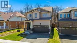 Craftsman inspired home featuring driveway, an attached garage, and board and batten siding - 
